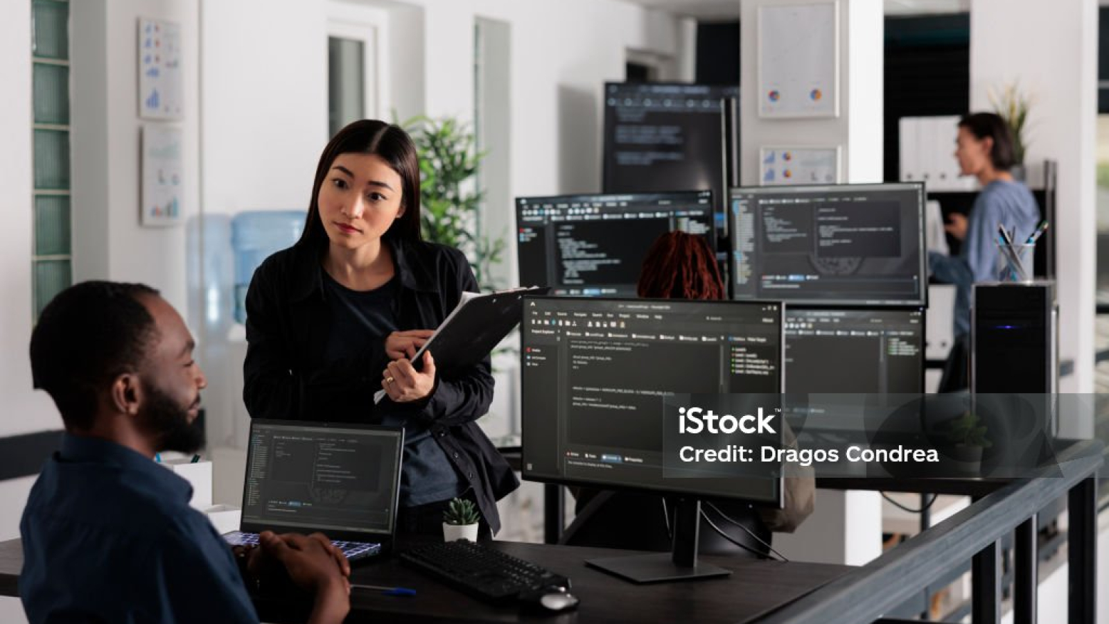 Team of system engineers working on software development with source code, looking at computer monitor. IT app developer writing ai algorithm in office, online cloud computing in agency